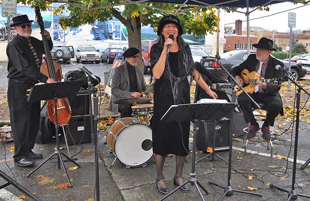 Trio of Three with Robin Dalynn singing perform at the Halloween Festival on Main Street.