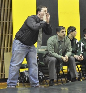 Auburn's new wrestling head coach Dennis Herren in action during the Trojans' dual meet against Rogers.