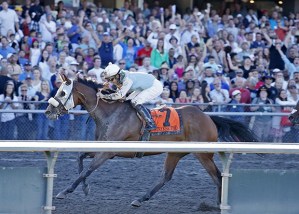 Leslie Mawing and Stryker Phd power to the lead in the stretch run of the 80th Longacres Mile. The two-time Mile champion is expected to enter the Muckleshoot Tribal Classic on Sept. 13.