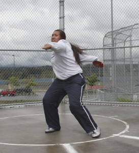 Marissa Paopao winds up with the discus from the circle at Auburn Mountainview High School.