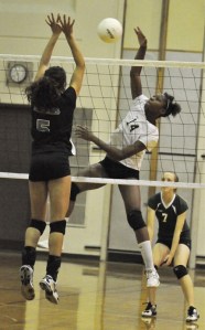 Auburn's Isia Johnson tries to slip one by Bonney Lake defender Taylor Moss.