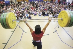 Olympic weightlifter Melanie Roach of Bonney Lake hoists 187 pounds in the clean-and-jerk lift in front of an October all-school assembly at Washington Elementary School. In the Beijing Olympics
