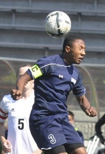 Auburn Riverside’s Adrian Correa heads a ball during the Ravens’ 3-1 loss to Ballard for third place at the state 3A soccer playoffs at Sparks Stadium in Puyallup last Saturday