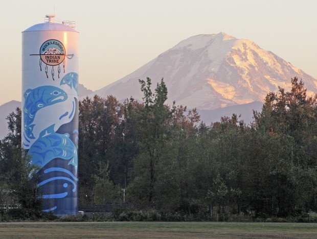 Brothers and artists Rolf and Peter Goetzinger transformed a 120-foot tall Muckleshoot Tribe water tank into beautiful public art. The tank sits in a wooded area north of State Route 164