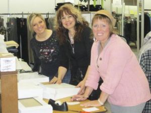 Wrapping donated gifts at Rottles Clothing and Shoes are