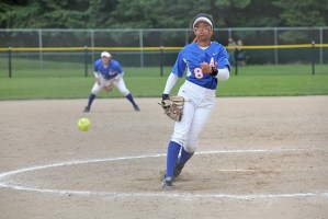 The Lions' Zoe Collins fires a pitch against Kelso in district action Saturday.