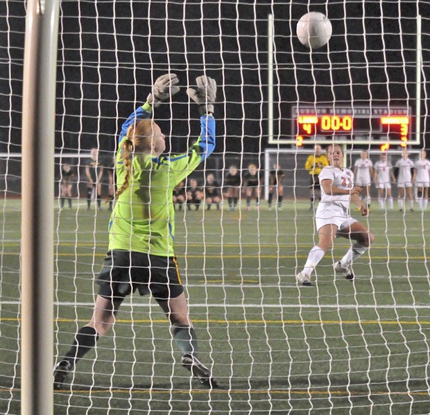 The Lions' Delene Colburn boots the fifth penalty kick