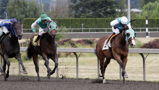 Mister Breeze and jockey Rocco Bowen lead to the wire Friday in the $12