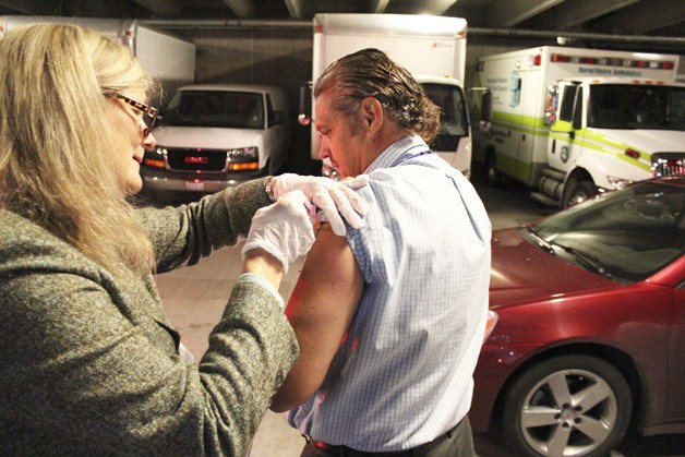 MultiCare Health System employees receive the influenza vaccine Oct. 18 as part of a mass vaccination clinic