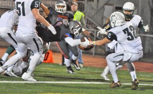 Gavin Robertson dives into the end zone to score for Auburn Mountainview.