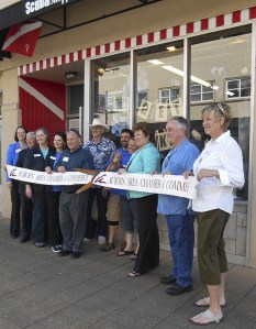 Auburn Area Chamber of Commerce representatives joined Mayor Nancy Backus and staff of the Scuba Shoppe for a ribbon-cutting ceremony on Tuesday.