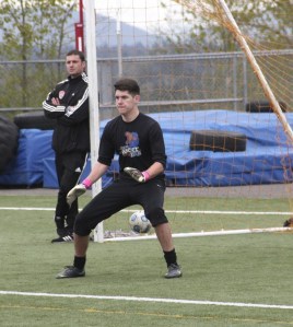 Auburn Mountainview's new boys soccer coach Jimmy Fioretti watches as junior goalkeeper Alex Fausko drills during practice.