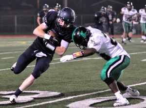 Auburn Riverside senior Drew Wallen runs for a few extra yards after a reception.