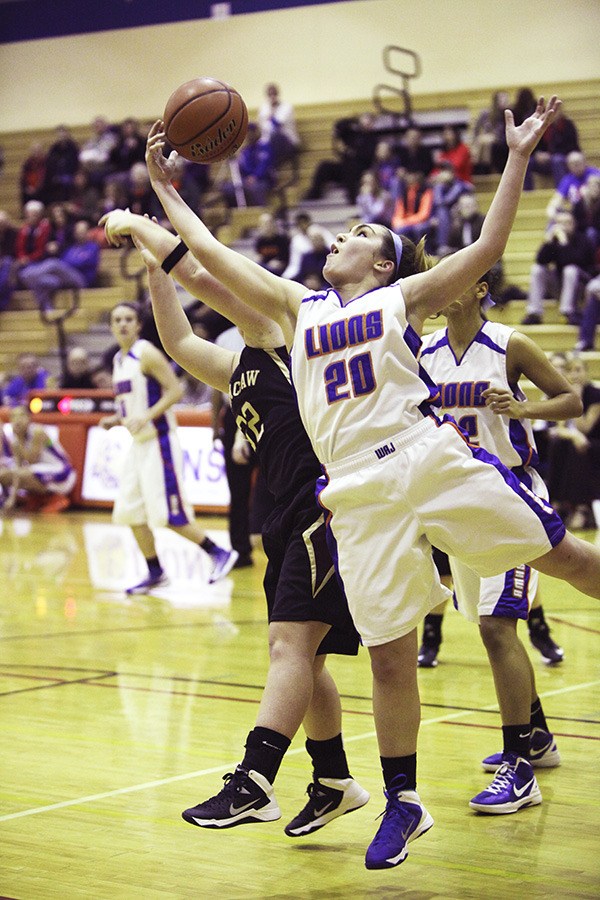 Senior Kaitlyn Jensen battles for a rebound.