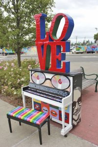 Suzy Fountaine's piano is a tribute to Elton John with a painted surface and mixed media elements.