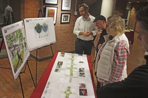 Residents and business owners study one of two perspectives for the downtown commercial corridor during an open house in the City Hall lobby last October. The City’s Main Street Urban Design Project team used the open house to receive feedback and ideas from the public on its proposed ideas to enhance downtown.