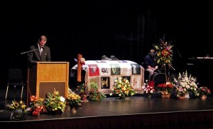City Chaplain Michael Hursh leads the assembly in prayer at the memorial for Cameron Christian.