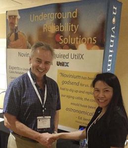Novinium CEO Glen Bertini shakes hands with Yingli Wen