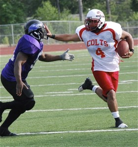 South King County Colts’ Ryan Reynolds tries to shed a Renton Ravens’ pursuer during recent action. The Colts