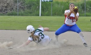 Auburn Mountainview's Emily Martinez fields the ball as a Peninsular runner slides into base during the Lions' win.