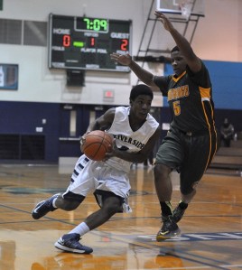 Auburn Riverside's Derek White drives against Kentridge's Kesean Kelly.