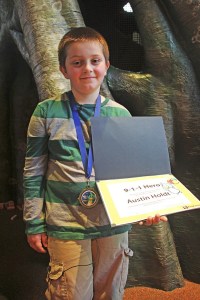 Pacific's Austin Holdt is the recipient of the King County 911 Hero Award. The 9-year-old boy received the honor during a ceremony at Woodland Park Zoo on Thursday.