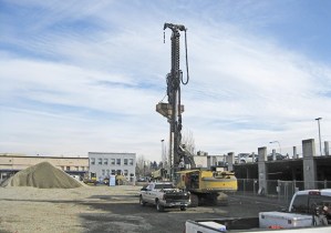 Crews and heavy equipment occupied the former Cavanaugh block in downtown Auburn on Tuesday