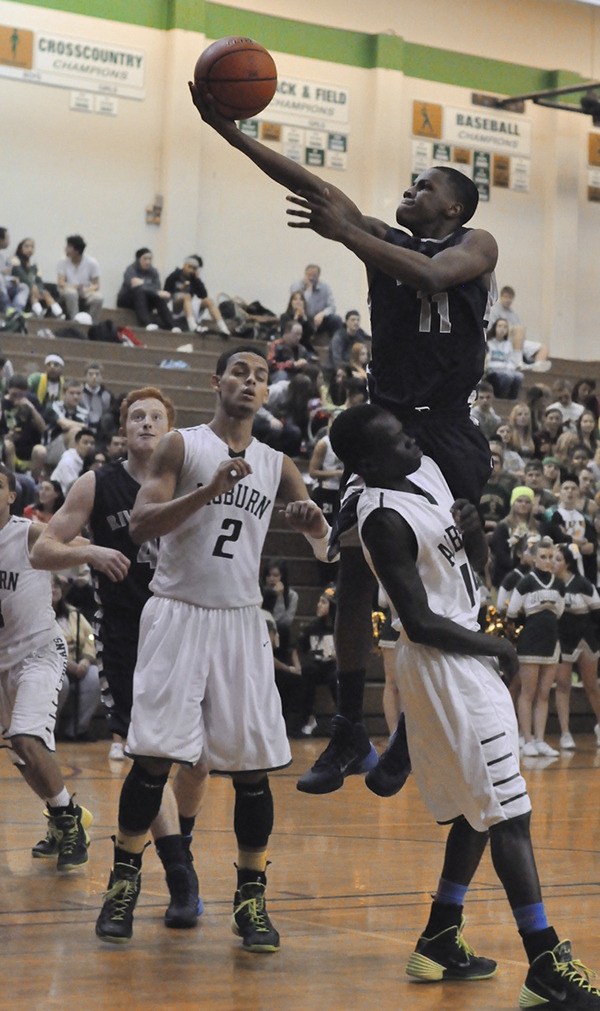 Derek Brown takes to the air to roll one in against Auburn.