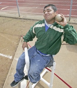 Alfredo Figueroa chucks the shot from Auburn's throwers chair.