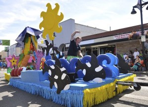 The Auburn International Farmers Market float was part of the Auburn Days grand parade last year. The parade returns to Main Street on Saturday