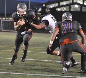 Auburn Mountainview's Gresch Jensen runs for one of his two touchdowns during the Lions' rout of Bonney Lake on Thursday night.