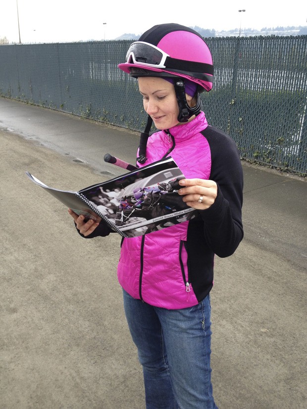 Eliska Kubinova reads about her record-setting 2012 season in the 2013 Emerald Downs media guide.