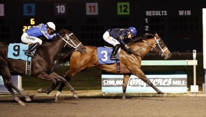 Kiss My Lulu and jockey Juan Gutierrez lead to the wire in the feature race for 3-year-old fillies Friday at Emerald Downs.