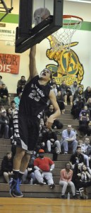 Auburn Riverside's EJ Taylor elevates for a shot.
