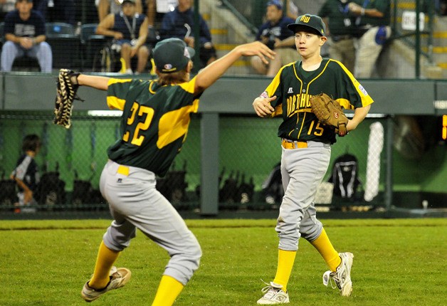 First baseman Hudson Byorick (22) dances onto the field to congratulate Dylan Davis after Auburn's 7-4 victory over Pearland