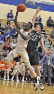 Ki'Jan Weisinger drives for two of his 18 points for Auburn Mountainview.