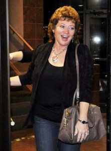 Mayor-elect Nancy Backus receives applause from supporters as she arrives at OddFellas Pub & Eatery Thursday evening for a celebration.