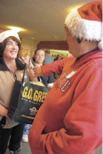 Go green was a centerpiece of the ‘Morning of Giving’ breakfast. Auburn Angels volunteer Abby Santos