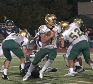 Junior quarterback Justin Ioimo carries the ball for Auburn.