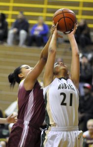 Auburn's Shani-Lynn Prater battles a Jefferson defender for the ball.