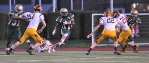 Auburn's Kevin Clay looks to split the Enumclaw defense and pick up yardage during SPSL 3A play Thursday night.