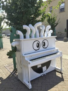 Artist-author Vikram Madan turned a piano into a black and white cartoon figure named Mr. Tubehead. The piano is among those on display throughout Auburn this summer.