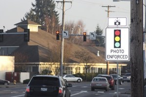 Crews are removing red light photo-enforced camera equipment at Auburn intersections.