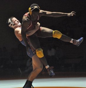 Auburn Mountainview's Tyler King manhandles Franklin Pierce's Torrey Turner during a dual meet.
