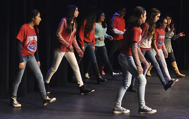 A Latino group from Olympic Middle School performs on stage during Celebrate Change