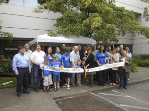 Representatives from the Auburn Area Chamber of Commerce and community leaders joined the staff from Puget Sound Hardware for a ribbon-cutting ceremony.