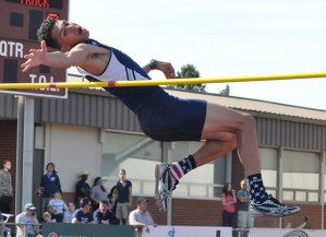Auburn Riverside's Rashon Miller attempts to clear the bar during the South Puget Sound League 3A track and field meet Friday at Sunset Stadium in Sumner. Miller won with a jump of 6 feet