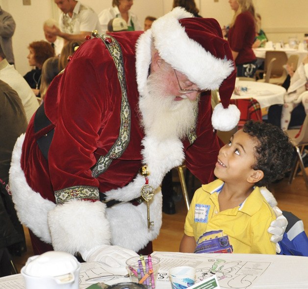 St. Nick chats with Donovan Hopkins at last year's Breakfast with Santa event at the Auburn Senior Activity Center. Santa and his elves return for the special occasion Dec. 10.
