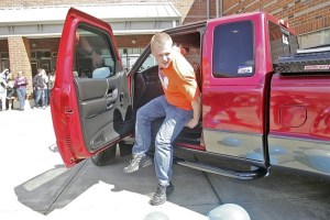 Garrett Light gets out of his restored Mazda truck during last week’s pep assembly at Auburn Mountainview High School. The revitalized truck came courtesy of CARSTAR Federal Way Collision and the Make-A-Wish Foundation.