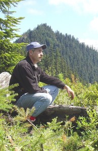 Author Robert Blevins surveys the rough terrain where famed hijacker D.B. Cooper might have landed during his escape in 1971.